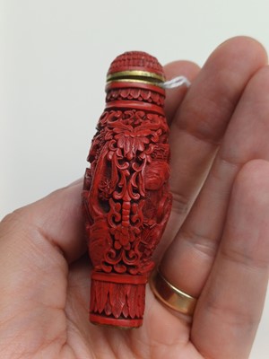 Lot 77 - A CHINESE CINNABAR LACQUER 'HORSES' SNUFF BOTTLE