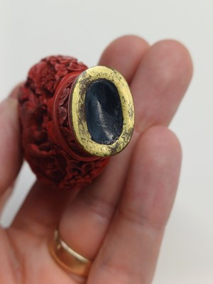 Lot 77 - A CHINESE CINNABAR LACQUER 'HORSES' SNUFF BOTTLE