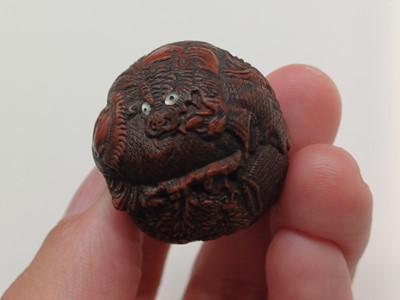 Lot 850 - A JAPANESE CARVED WALNUT NETSUKE (KURUMI), SIGNED SEIMIN