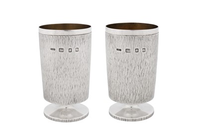 Lot 457 - A pair of Elizabeth II modernist sterling silver goblets or footed beakers, London 1966 by Gerald Benney (1930-2008)