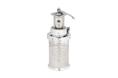 Lot 214 - A SILVER PLATED SAMPLE OF A BATTERY POWERED MINERS LAMP