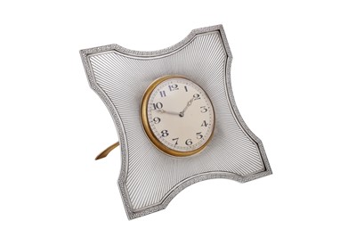 Lot 138 - A George V art deco sterling silver strut desk time piece / cock, London 1927 by Goldsmiths and Silversmiths
