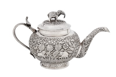 Lot 208 - A late 19th / early 20th century Anglo – Indian unmarked silver teapot, Lucknow circa 1900