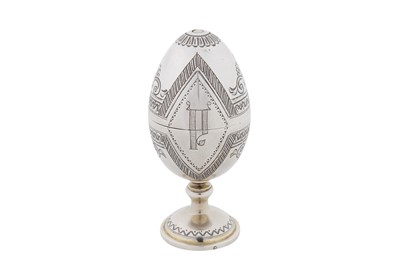 Lot 331 - An Alexander III late 19th century Russian silver traveling pair of egg cups, Saint Petersburg circa 1890 by PJS (unidentified active 1886-1908)