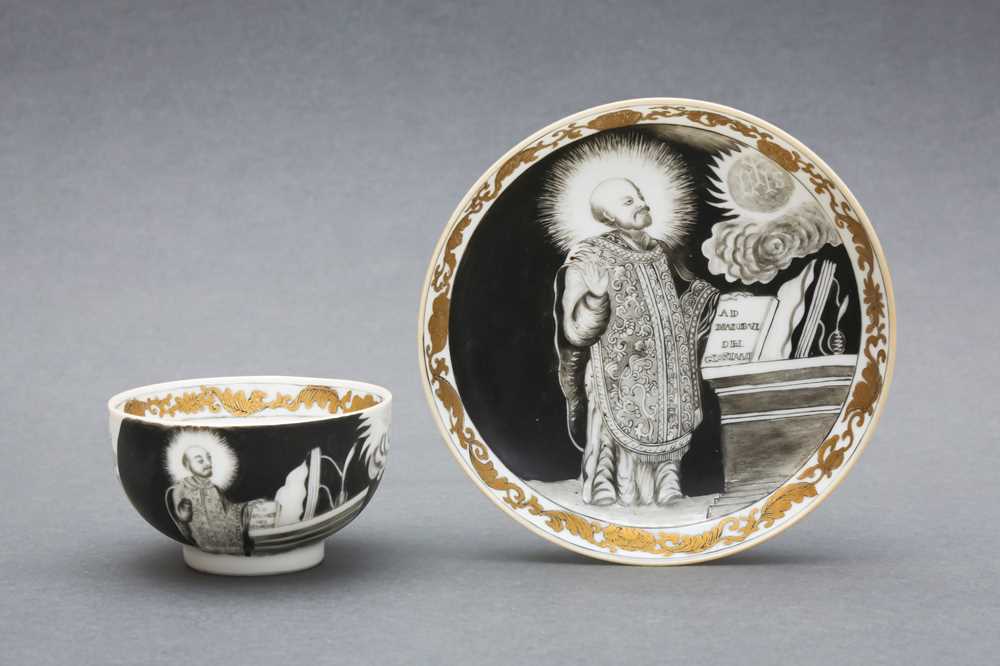 Lot 49 - A RARE CHINESE EN-GRISAILLE 'IGNATIUS OF LOYOLA' CUP AND SAUCER