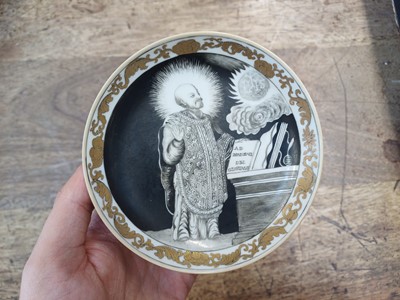 Lot 49 - A RARE CHINESE EN-GRISAILLE 'IGNATIUS OF LOYOLA' CUP AND SAUCER