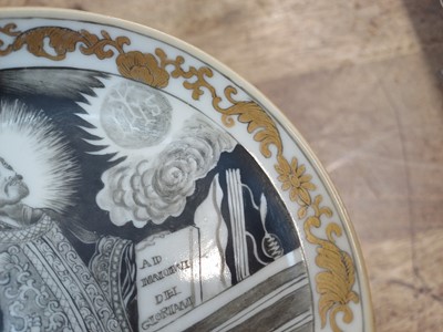 Lot 49 - A RARE CHINESE EN-GRISAILLE 'IGNATIUS OF LOYOLA' CUP AND SAUCER