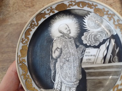 Lot 49 - A RARE CHINESE EN-GRISAILLE 'IGNATIUS OF LOYOLA' CUP AND SAUCER