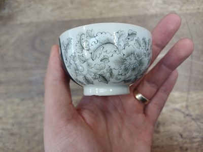 Lot 49 - A RARE CHINESE EN-GRISAILLE 'IGNATIUS OF LOYOLA' CUP AND SAUCER