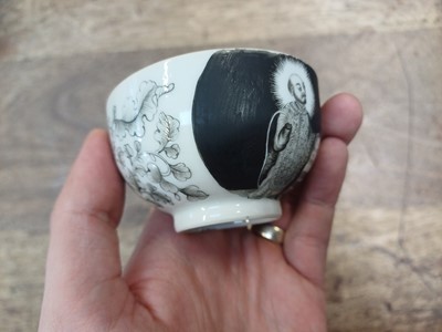 Lot 49 - A RARE CHINESE EN-GRISAILLE 'IGNATIUS OF LOYOLA' CUP AND SAUCER