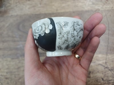 Lot 49 - A RARE CHINESE EN-GRISAILLE 'IGNATIUS OF LOYOLA' CUP AND SAUCER