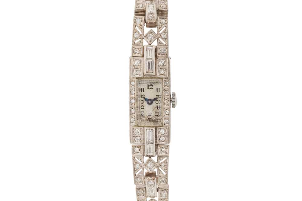 Lot 266 - A LADY'S ART DECO PLATINUM AND DIAMOND COCKTAIL WATCH