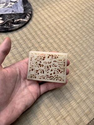 Lot 58 - A CHINESE CARVED CELADON JADE 'DRAGON' PLAQUE