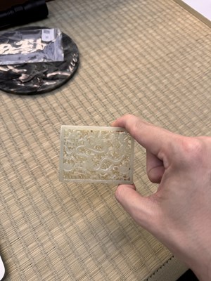 Lot 58 - A CHINESE CARVED CELADON JADE 'DRAGON' PLAQUE