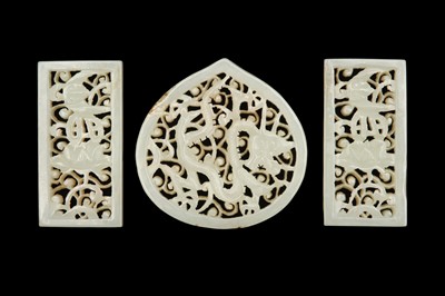 Lot 59 - A SET OF THREE CHINESE PALE CELADON 'DRAGON' JADE BELT PLAQUES