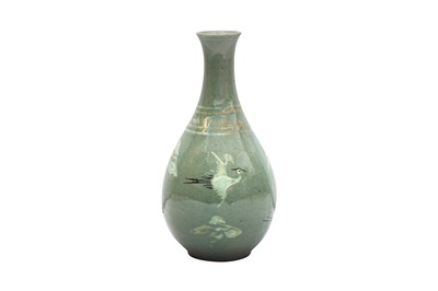 Lot 431 - A KOREAN INLAID SLIP-DECORATED CELADON 'CRANE' BOTTLE VASE