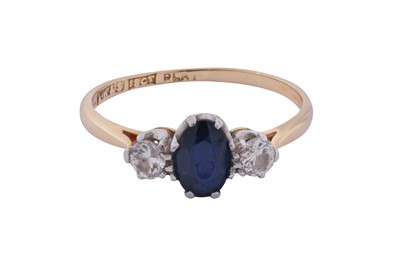 Lot 208 - A SAPPHIRE AND DIAMOND THREE-STONE RING