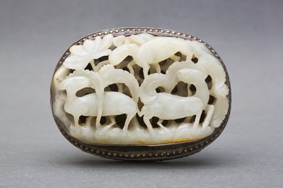 Lot 57 - A CHINESE RETICULATED WHITE JADE ‘THREE RAMS’ BELT PLAQUE