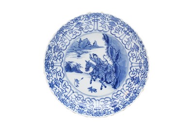 Lot 31 - A CHINESE BLUE AND WHITE 'HUNTING SCENE' DISH