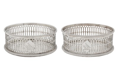 Lot 422 - A pair of George III sterling silver wine coasters, London 1776 by Thomas Daniell