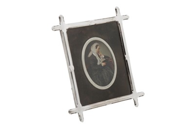 Lot 19 - A Victorian sterling silver photograph frame, London 1871 by Henry William Dee, retailed by Jenner and Knewstub