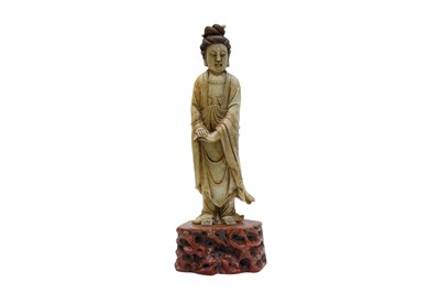 Lot 74 - A LARGE CHINESE CARVED SOAPSTONE FIGURE OF GUANYIN