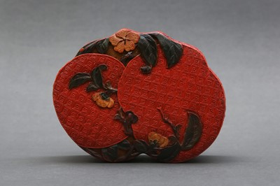 Lot 79 - A CHINESE POLYCHROME THREE-COLOUR LACQUER 'DOUBLE-PEACH' FORM BOX AND COVER