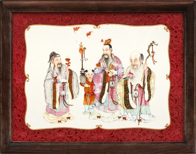 Lot 949 - A CHINESE FAMILLE-ROSE RUBY-GROUND 'SANXING' PLAQUE