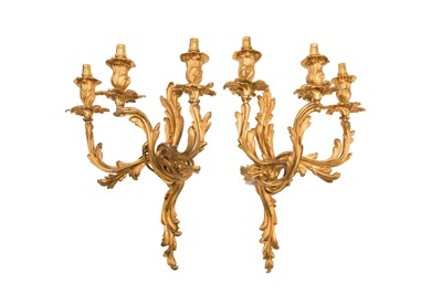 Lot 202 - A PAIR OF ROCOCO STYLE GILT BRASS THREE-BRANCH WALL SCONCES, LATE 19TH/EARLY 20TH CENTURY