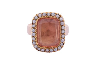 Lot 33 - A TOPAZ AND SEED PEARL RING