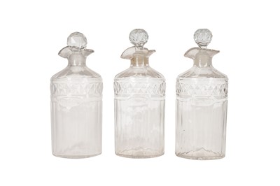 Lot 128 - A SET OF THREE GEORGE III GLASS SPIRIT DECANTERS, CIRCA 1880S