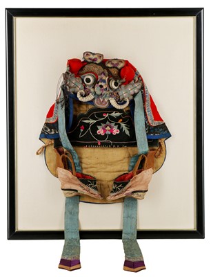 Lot 917 - A CHINESE EMBROIDERED SILK CHILD'S HAT IN FRAME