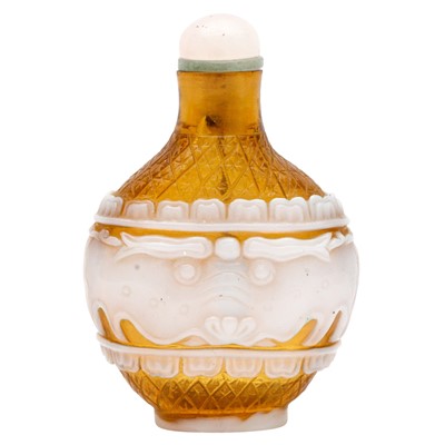 Lot 297 - A Chinese Beijing overlay glass 'archaistic' overlay snuff bottle, 19th century