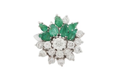 Lot 141 - A diamond and emerald dress ring