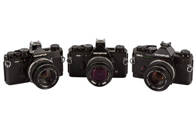 Lot 211 - A Selection of Black OIympus OM2 SLR Cameras
