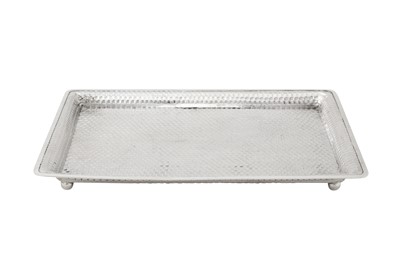 Lot 156 - An early 20th century Anglo – Indian silver dressing table tray, Cutch, Bhuj circa 1910 by Oomersi Mawji jnr (active 1890-1930)