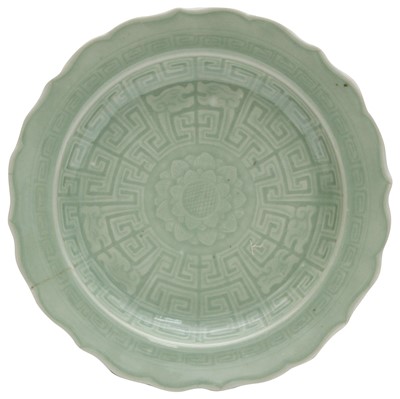 Lot 211 - A CHINESE CELADON-GLAZED MOULDED 'LOTUS' DISH