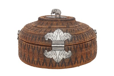 Lot 206 - A 19th century Ceylonese (Sri Lankan) silver mounted woven cane basket (vel- pettiya), Kandy circa 1800-50