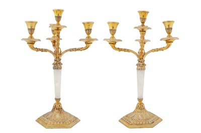 Lot 301 - A pair of mid-20th century Italian 800 standard silver gilt four-light candelabra, 1934-44, maker’s mark obscured, retailed by Pinci Roma