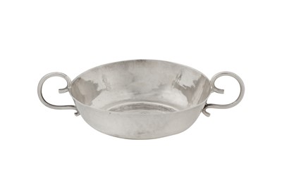 Lot 482 - A Charles II sterling silver small wine taster, London 1677 probably by RS, possibly for Richard Shaw (free. 1670)