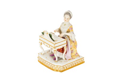 Lot 144 - A Meissen porcelain figure of a lady playing a spinet