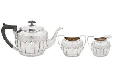 Lot 409 - A Victorian sterling silver three-piece bachelor tea service, Sheffield 1890 by Albert Henry Thompson