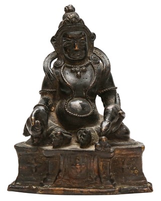 Lot 669 - A SINO-TIBETAN BRONZE FIGURE OF JAMBHALA