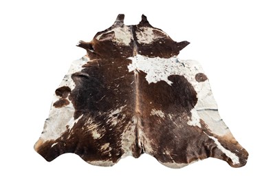 Lot 29 - A COW HIDE RUG