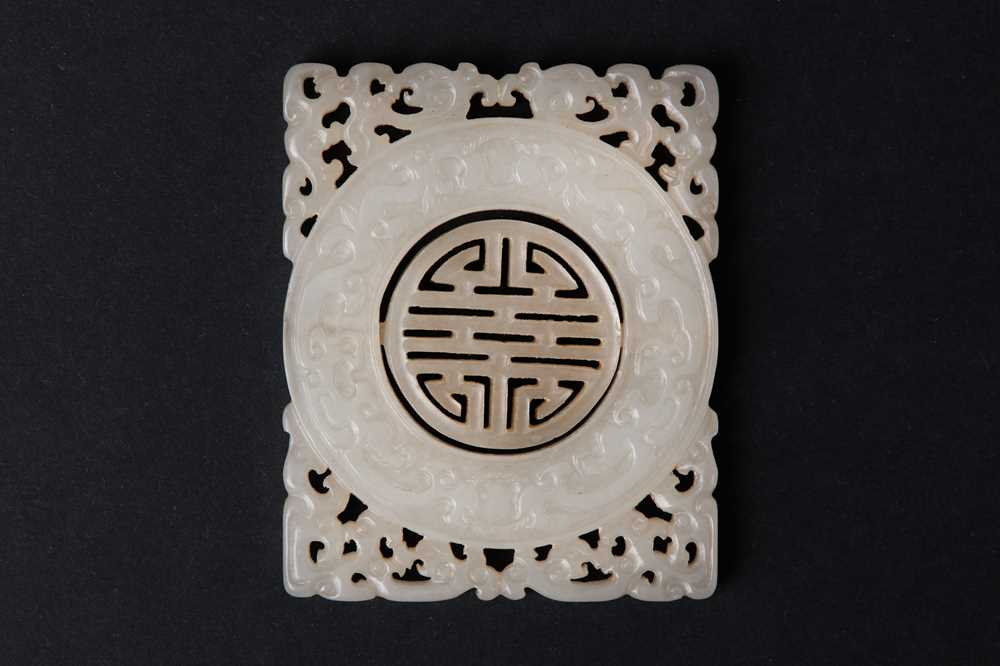 63 - A CHINESE PALE CELADON JADE RETICULATED 'SHOU' PLAQUE