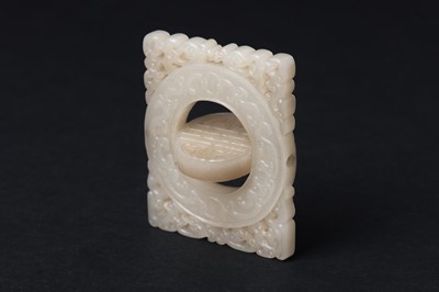 Lot 63 - A CHINESE PALE CELADON JADE RETICULATED 'SHOU' PLAQUE