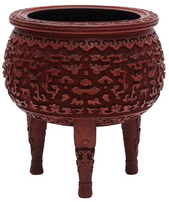 Lot 885 - A CHINESE CARVED LACQUER 'ARCHAISTIC' TRIPOD CENSER