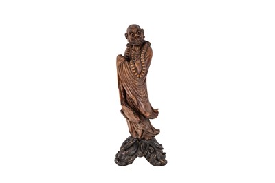 Lot 64 - CHINESE CARVED WOOD STATUE LUOHAN TOGETHER WITH A CARVED INDONESIAN FIGURE OF A MYTHICAL BEAST