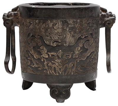 Lot 683 - A CHINESE BRONZE ARCHAISTIC TRIPOD DOUBLE-HANDLED CENSER