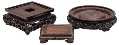 Lot 799 - A GROUP OF THREE CHINESE CARVED WOOD STANDS
